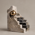 Full view of abstract staircase sculpture with dark veined steps and gold-toned sphere, without text
