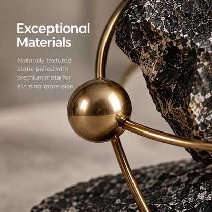 Dark orbital sculpture styled on a neutral display surface